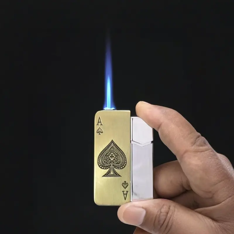 Gold Ace of Spades metal lighter producing blue jet flame