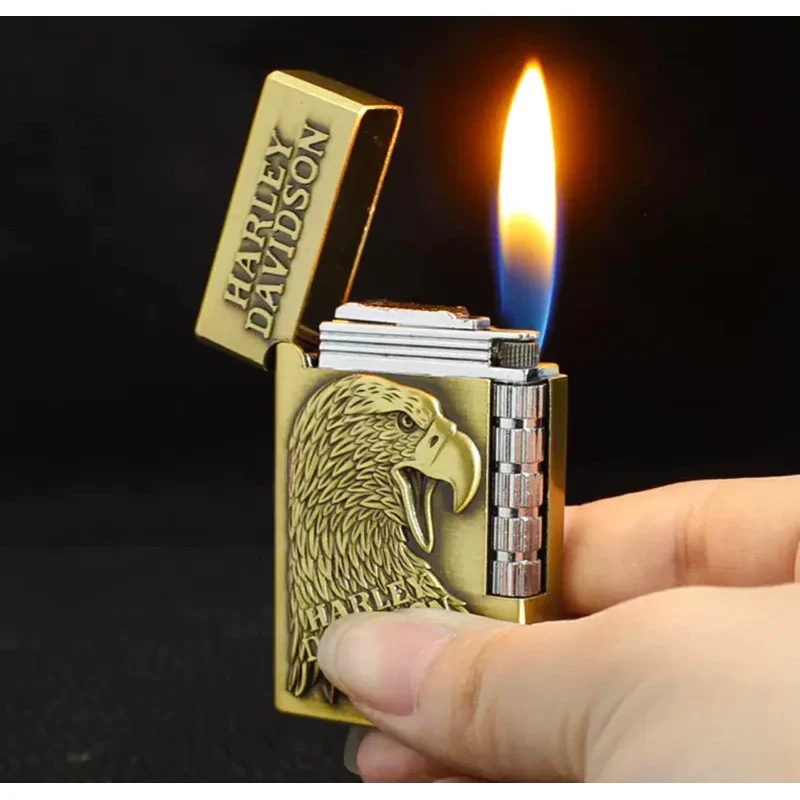 Hand holding Harley Davidson Eagle Lighter with soft flame lit